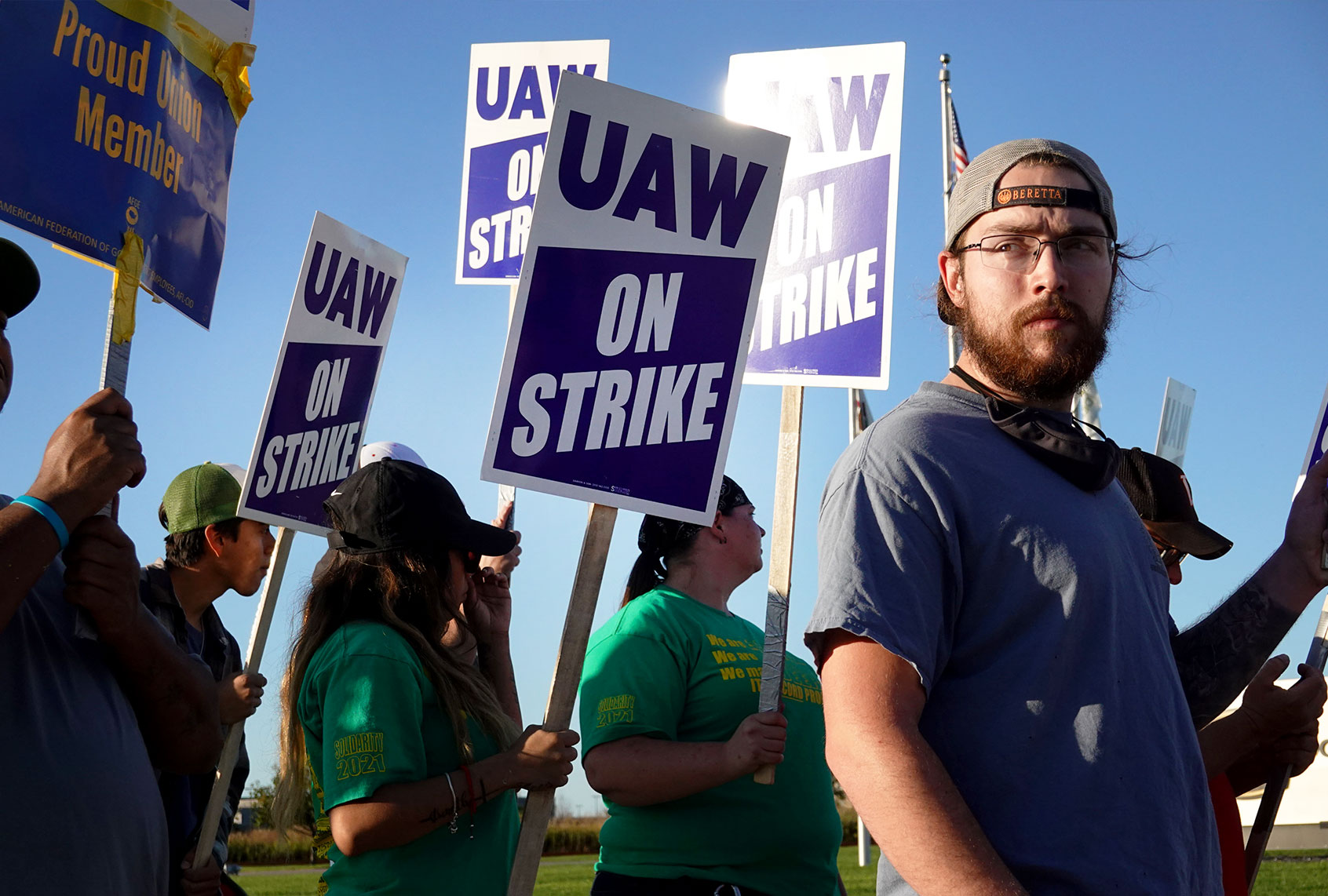 Workers picket outside of John Deere Harvester Works facility on October 14, 2021 in East Moline, Illinois. More than 10,000 Deere employees represented by the UAW walked off the job at midnight after failing to agree to term of a new contract. About 1,400 workers walked off the job at the Harvester Works plant where the company builds combines. (Scott Olson/Getty Images)