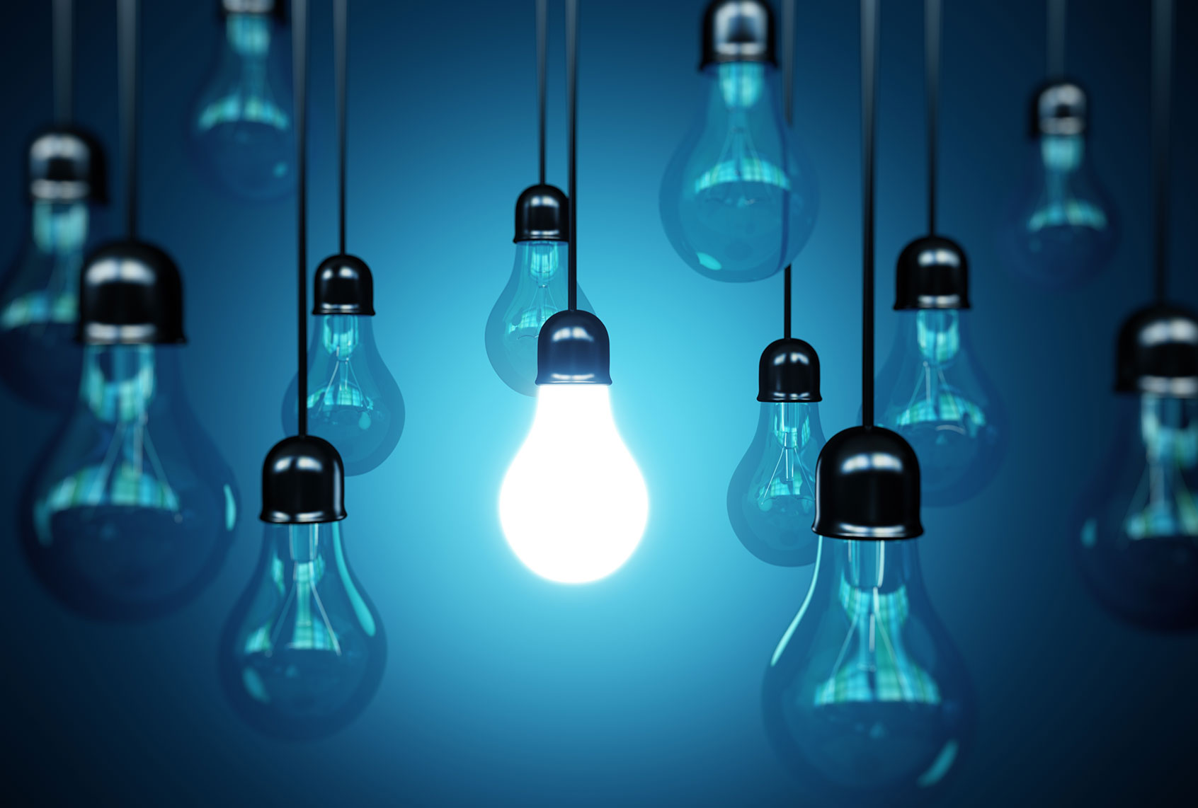 One lit light bulb among many unlit lightbulbs (Getty Images/Rulles)