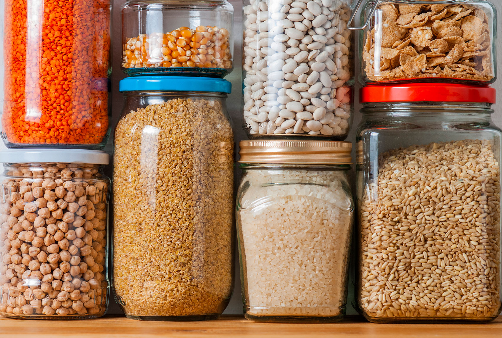 Shelf in Kitchen Pantry with Legumes (Getty Images/cemagraphics)