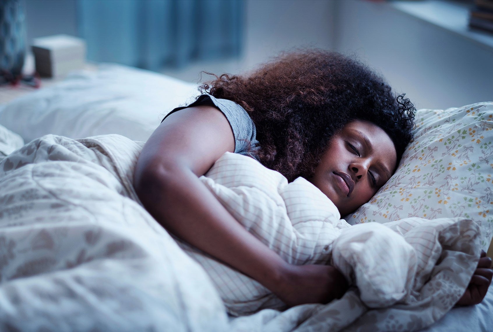 Woman sleeping in bed (Getty Images/JGI/Tom Grill)