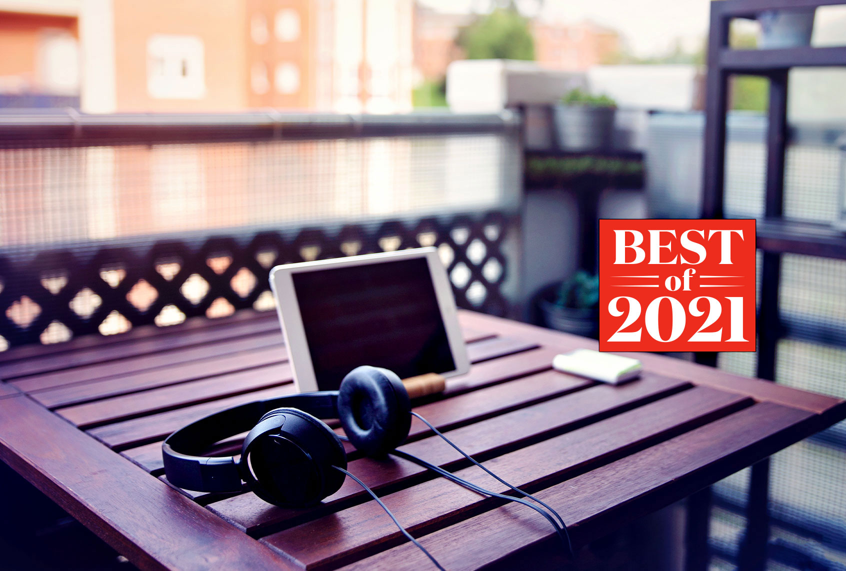 Improvised desk on the balcony, with a wooden table, a digital tablet and headphones (Photo illustration by Salon/Getty Images/Sol de Zuasnabar Brebbia)