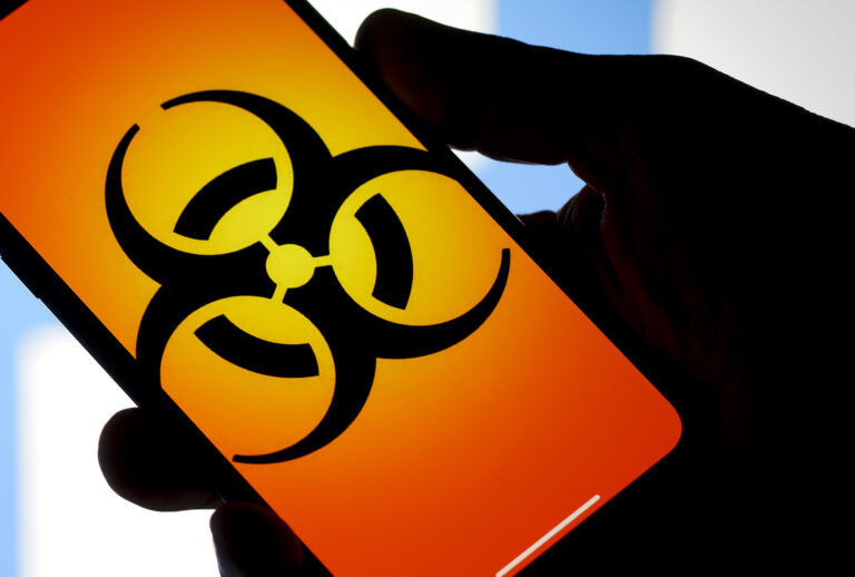 Biohazard sign on a phone. (Getty Images)
