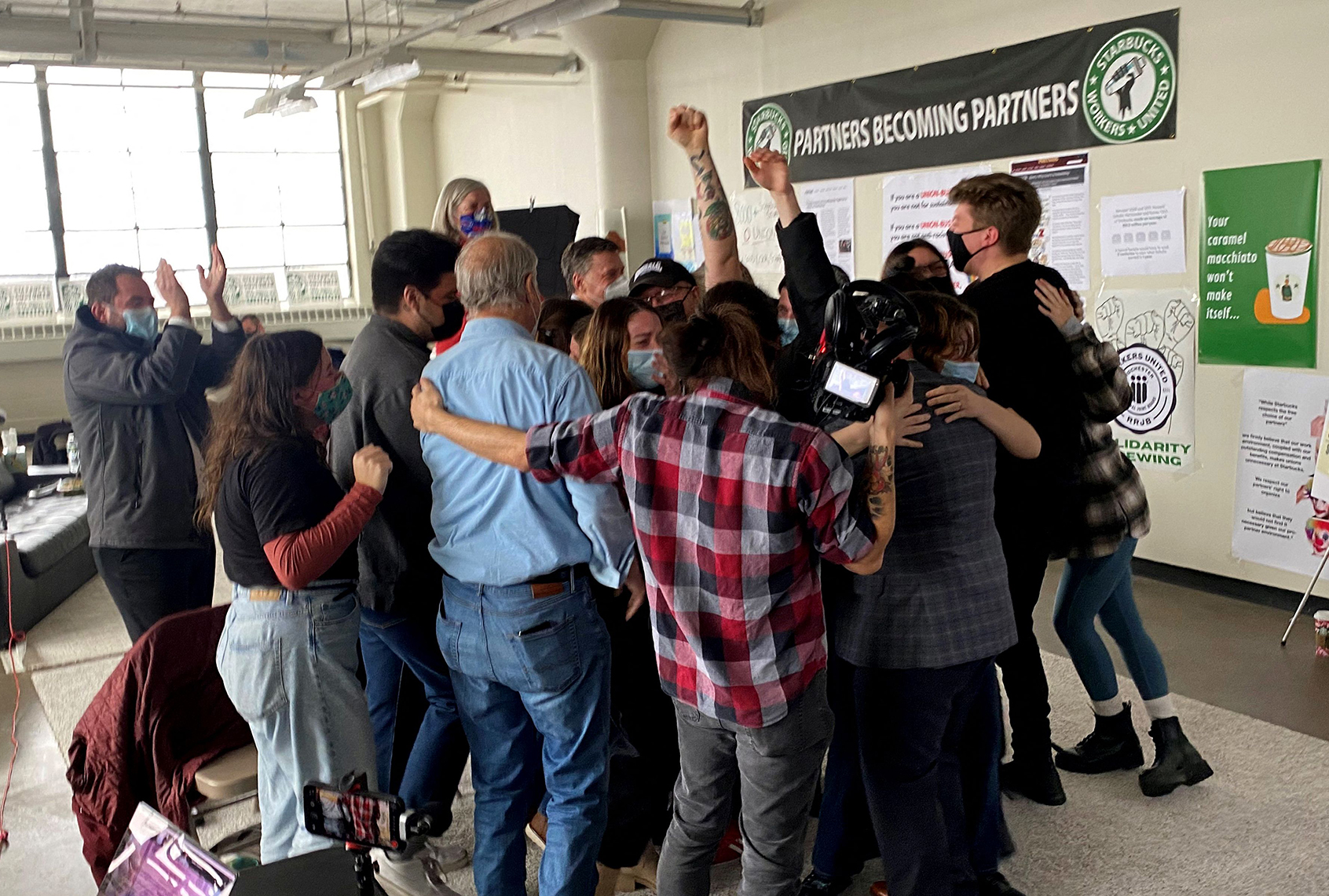 Starbucks employees celebrate after unionization votes are counted on December 9, 2021 in Buffalo, New York. (Eleonore SENS / AFP)