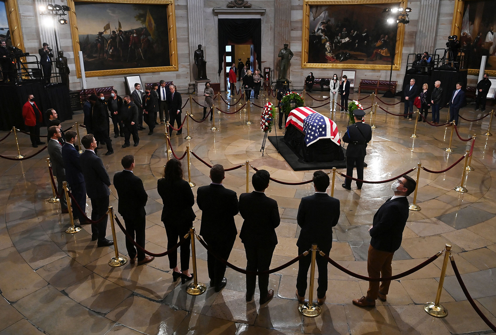 People pay their respects to former Senator Bob Dole (R-KS) in the US Capitol rotunda on December 9, 2021 in Washington, DC. (MATT MCCLAIN/POOL/AFP via Getty Images)