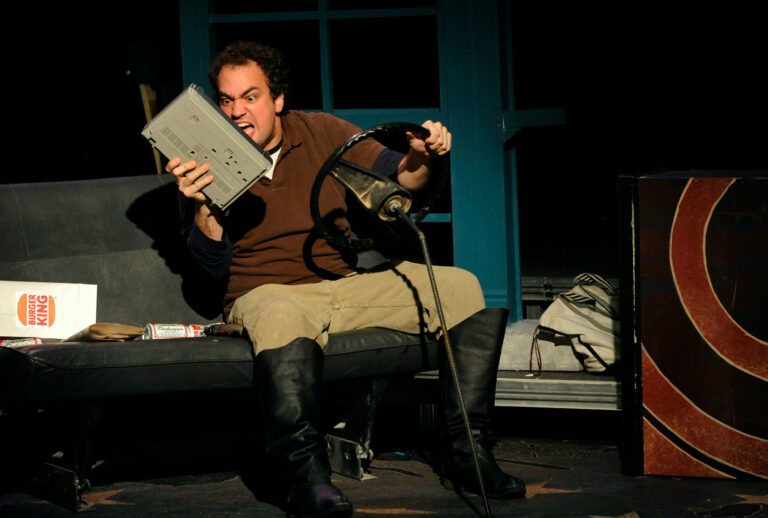 Actor Joseph Serrano screams at the voice of Richard Nixon while driving in the University of Northern Colorado production of Stephen Sondheim's "Assassins" in 2009 (Karl Gehring/The Denver Post via Getty Images)