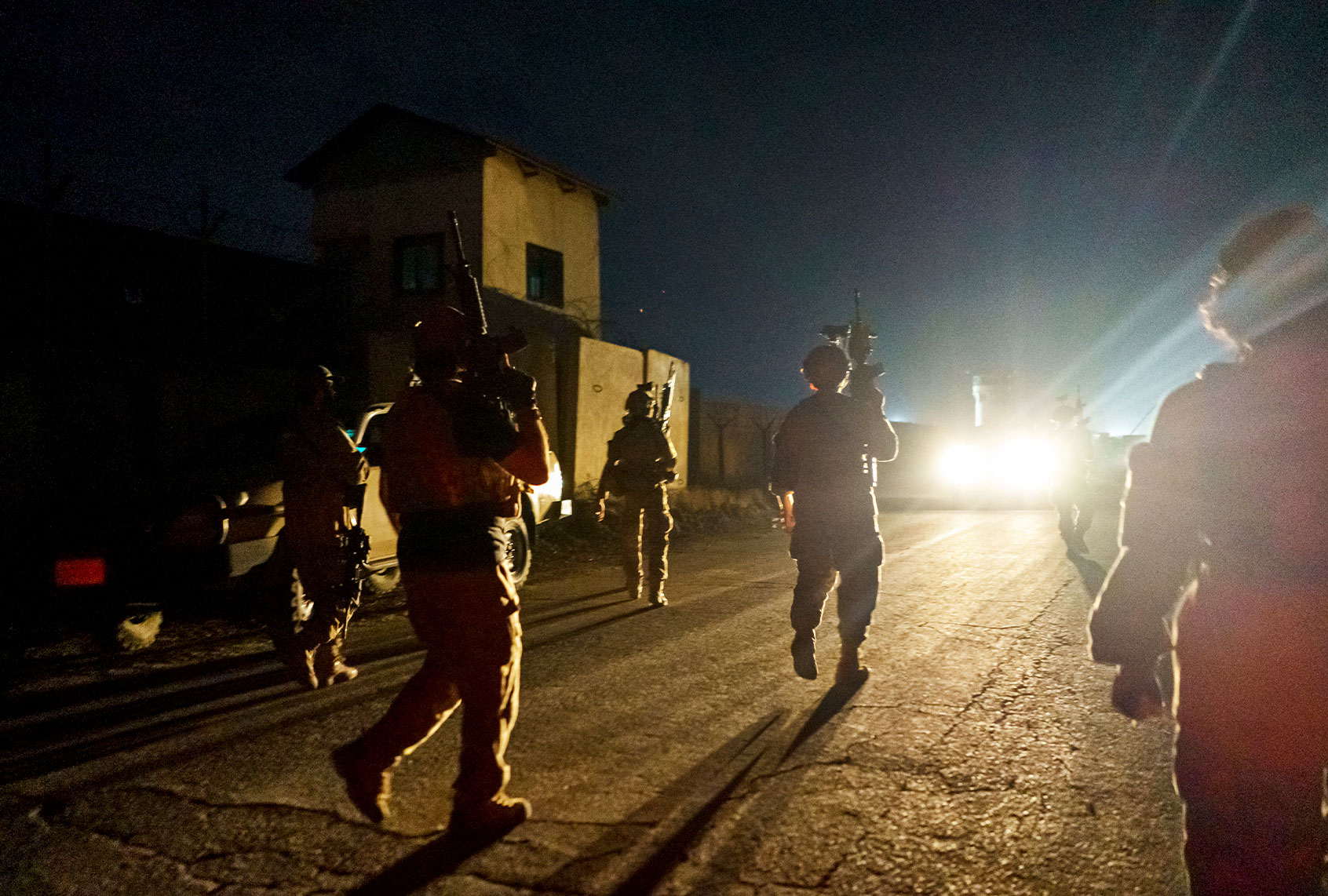 Taliban fighters from the Fateh Zwak unit storm into the Kabul International Airport, wielding American supplied weapons, equipment and uniforms after the United States Military have completed their withdrawal, in Kabul, Afghanistan, Tuesday, Aug. 31, 2021. (Marcus Yam/Los Angeles Times/Getty Images)