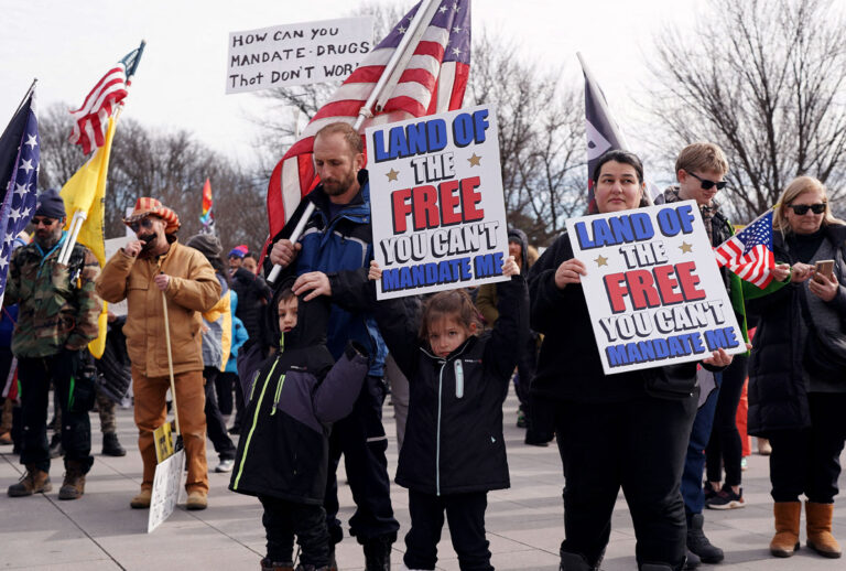 Demonstrators participate in a Defeat the Mandates march in Washington, DC, on January 23, 2022. - Demonstrators are protesting mask and Covid-19 vaccination mandates. (STEFANI REYNOLDS/AFP via Getty Images)