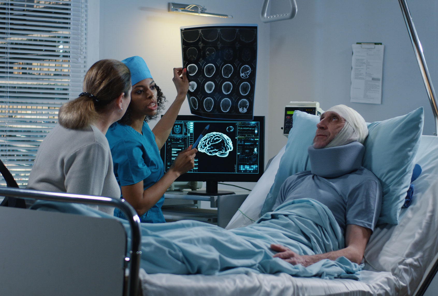 Medium shot of a female doctor discussing diagnosis with elderly male patient and his female relative (Getty Images/EvgeniyShkolenko)