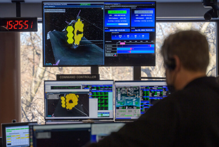 Engineering teams at NASAs James Webb Space Telescope Mission Operations Center at the Space Telescope Science Institute in Baltimore monitor progress as the observatory's second primary mirror wing rotates into position, on January 8, 2022 in Baltimore, Maryland. Webb, an infrared telescope with a 21.3-foot (6.5-meter) primary mirror, was folded up for launch and underwent an unprecedented deployment process to unfold in space. As NASA's next flagship observatory, Webb will study every phase of cosmic history from within our solar system to the most distant observable galaxies in the early universe. (Bill Ingalls/NASA via Getty Images)