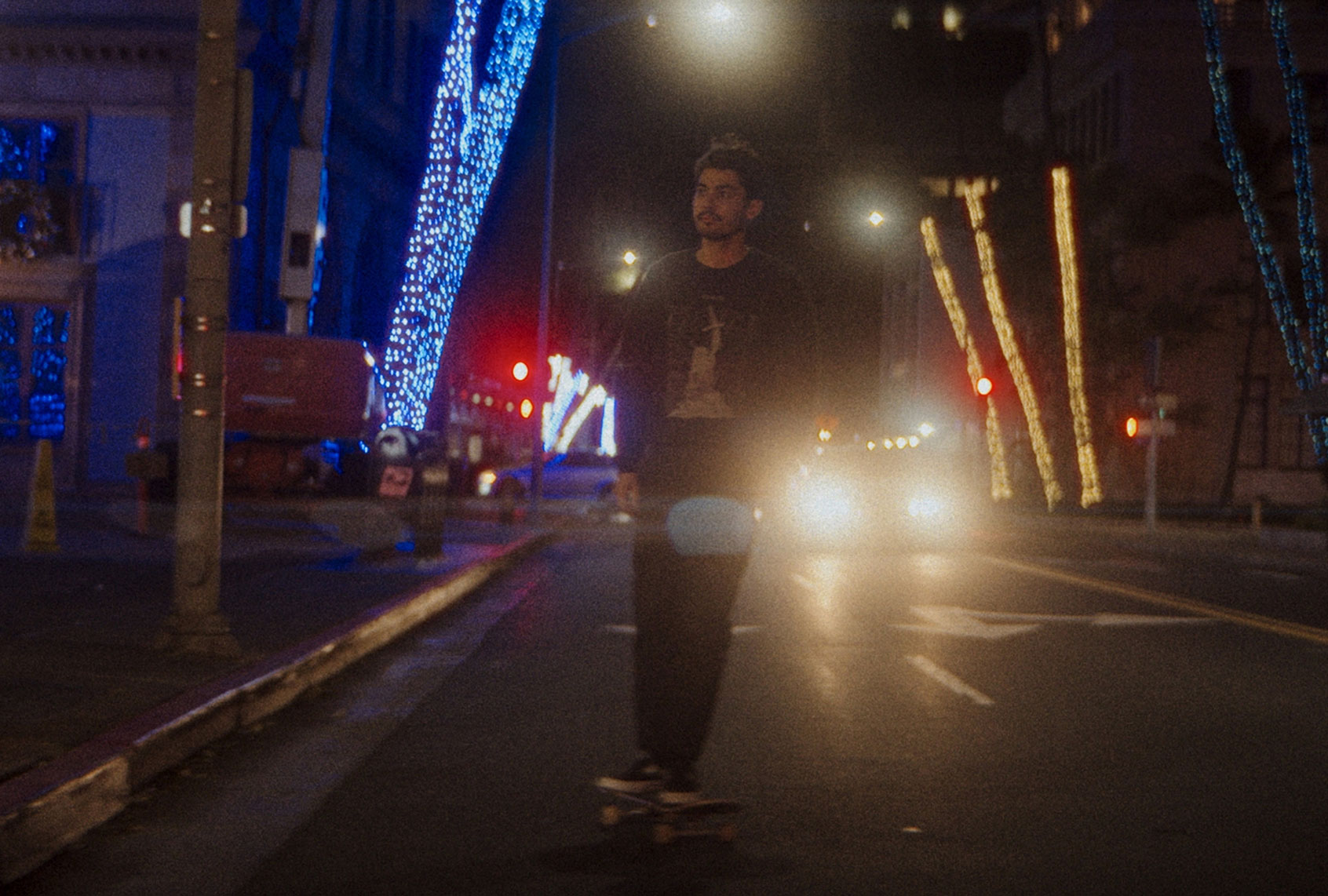 Naz Kawakami skateboarding down the street in a scene from "Every Day in Kaimuki" (Photos courtesy Every Day in Kaimuki)