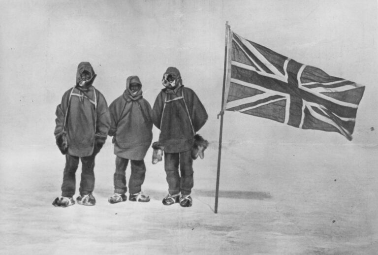 Irish explorer Sir Ernest Henry Shackleton and two members of his expedition team beside a Union Jack within 111 miles of the South Pole, a record feat, circa 1909 (Hulton Archive/Getty Images)
