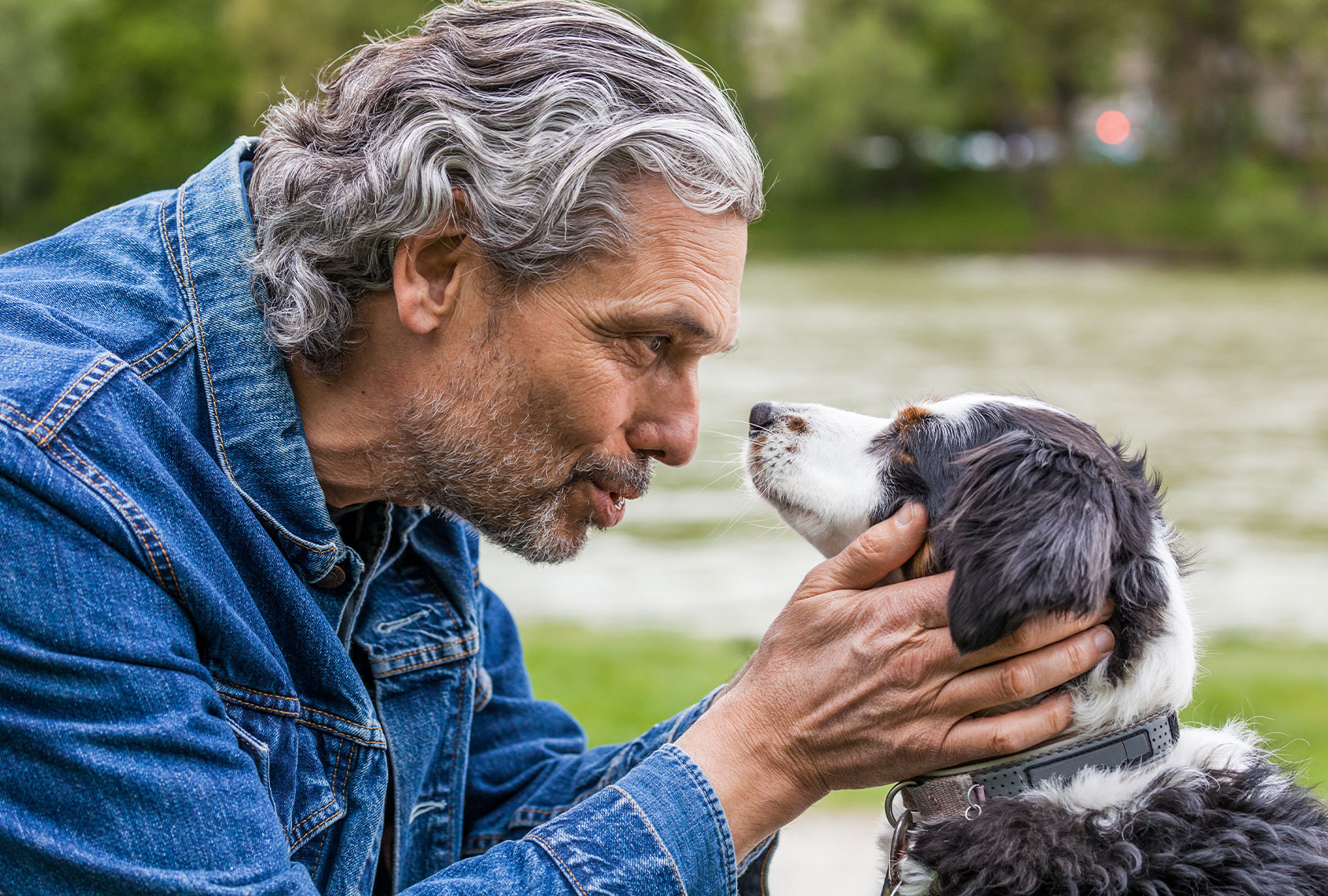 Man talking to his dog (Getty Images/Westend61)