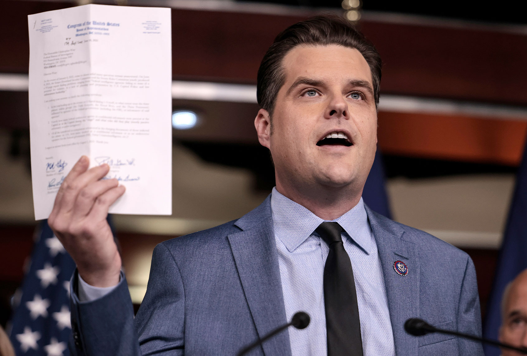 U.S. Rep. Matt Gaetz (R-FL) holds up a letter to FBI Director Christopher Wray at a news conference at the Capitol Building on December 07, 2021 in Washington, DC. (Anna Moneymaker/Getty Images)
