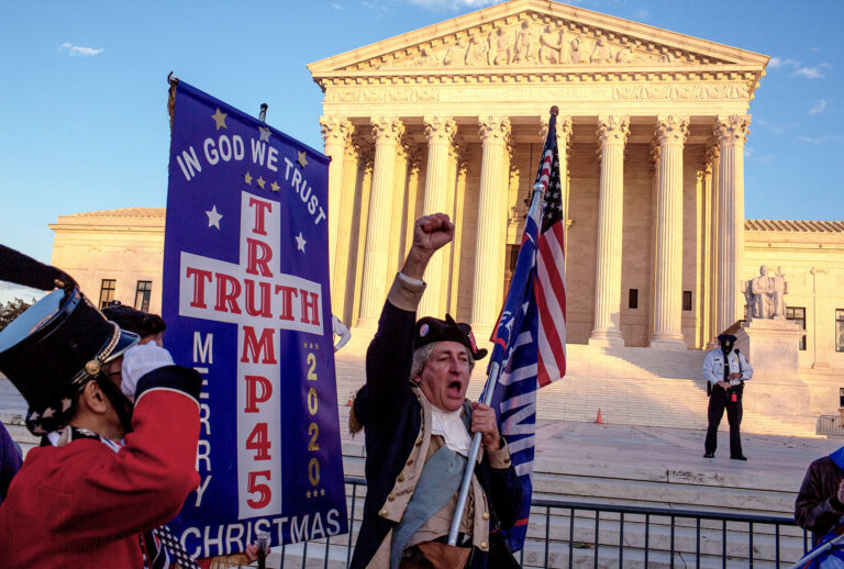 US President Donald Trump supporters demonstrating against the election results march to the Supreme Court to protest against the Court's decision not to overturn the election, on December 12, 2020 in Washington, D.C. Thousands of protesters who refuse to accept that President-elect Joe Biden won the election are rallying ahead of the electoral college vote to make Trump’s 306-to-232 loss official. (Andrew Lichtenstein/Corbis via Getty Images)