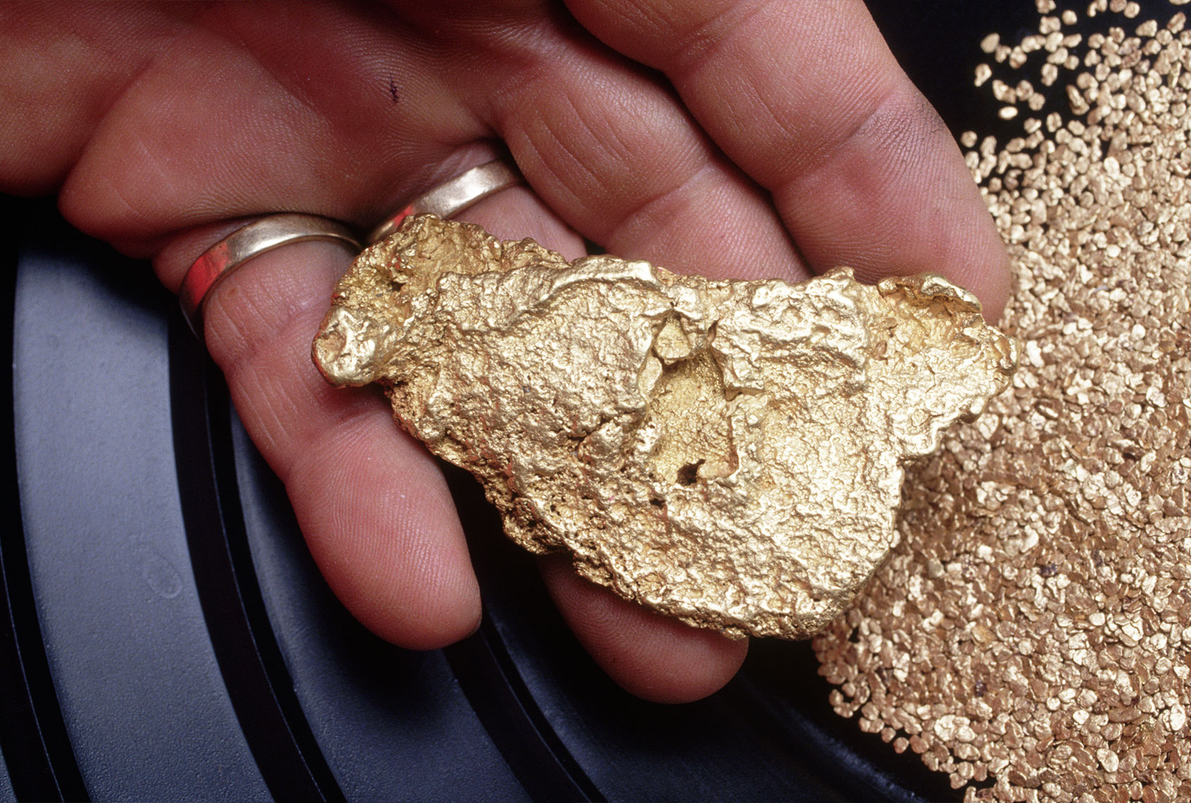 1993 California Gold Rush. Ralph Shock holds a nine ounce nugget found in the North fork of Tuolumne River outside Jamestown in mid May. Ralph says the nugget is worth between US $5,800 and $8,500. Nuggets that can be used for jewelry are prized and valued beyond their weight. (Steve Starr/CORBIS/Corbis via Getty Images)