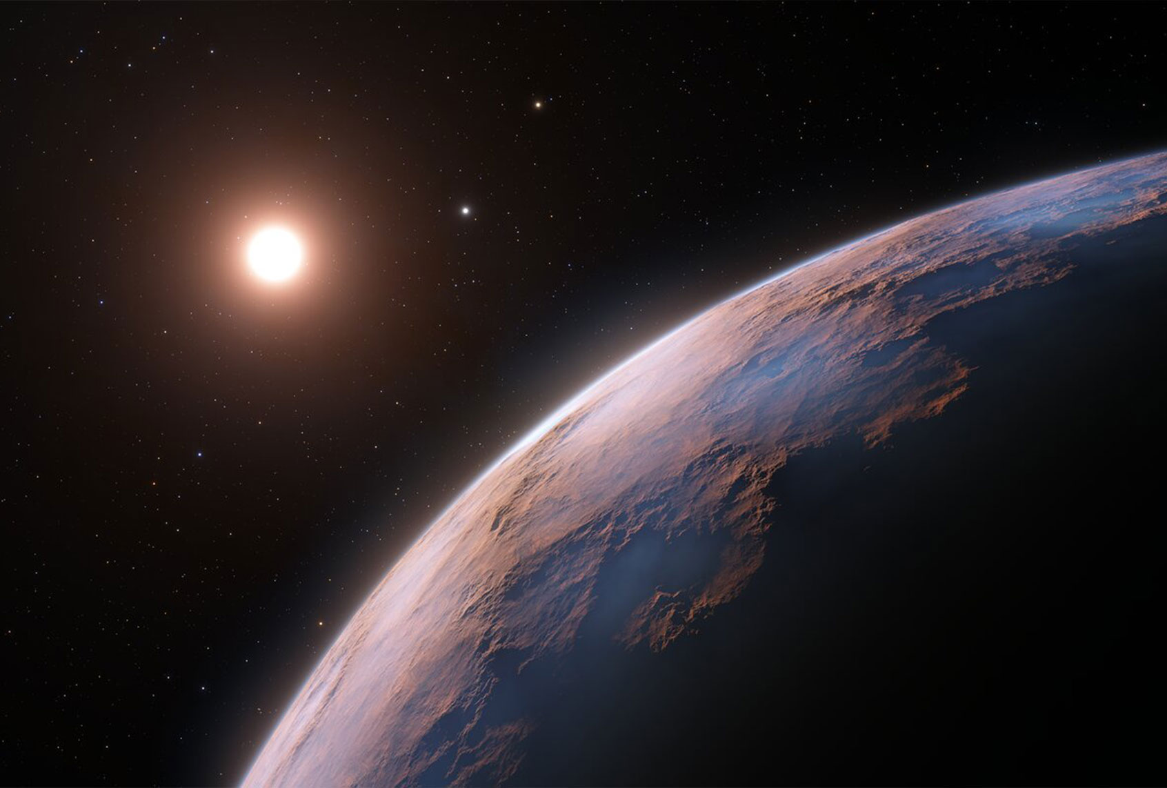 This artist’s impression shows a close-up view of Proxima d, a planet candidate recently found orbiting the red dwarf star Proxima Centauri, the closest star to the Solar System. The planet is believed to be rocky and to have a mass about a quarter that of Earth. Two other planets known to orbit Proxima Centauri are visible in the image too: Proxima b, a planet with about the same mass as Earth that orbits the star every 11 days and is within the habitable zone, and candidate Proxima c, which is on a longer five-year orbit around the star. (ESO/L. Calçada)