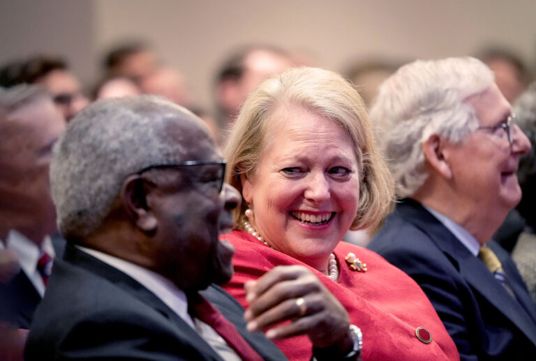 Associate Supreme Court Justice Clarence Thomas sits with his wife and conservative activist Virginia Thomas while he waits to speak at the Heritage Foundation on October 21, 2021 in Washington, DC. (Drew Angerer/Getty Images)