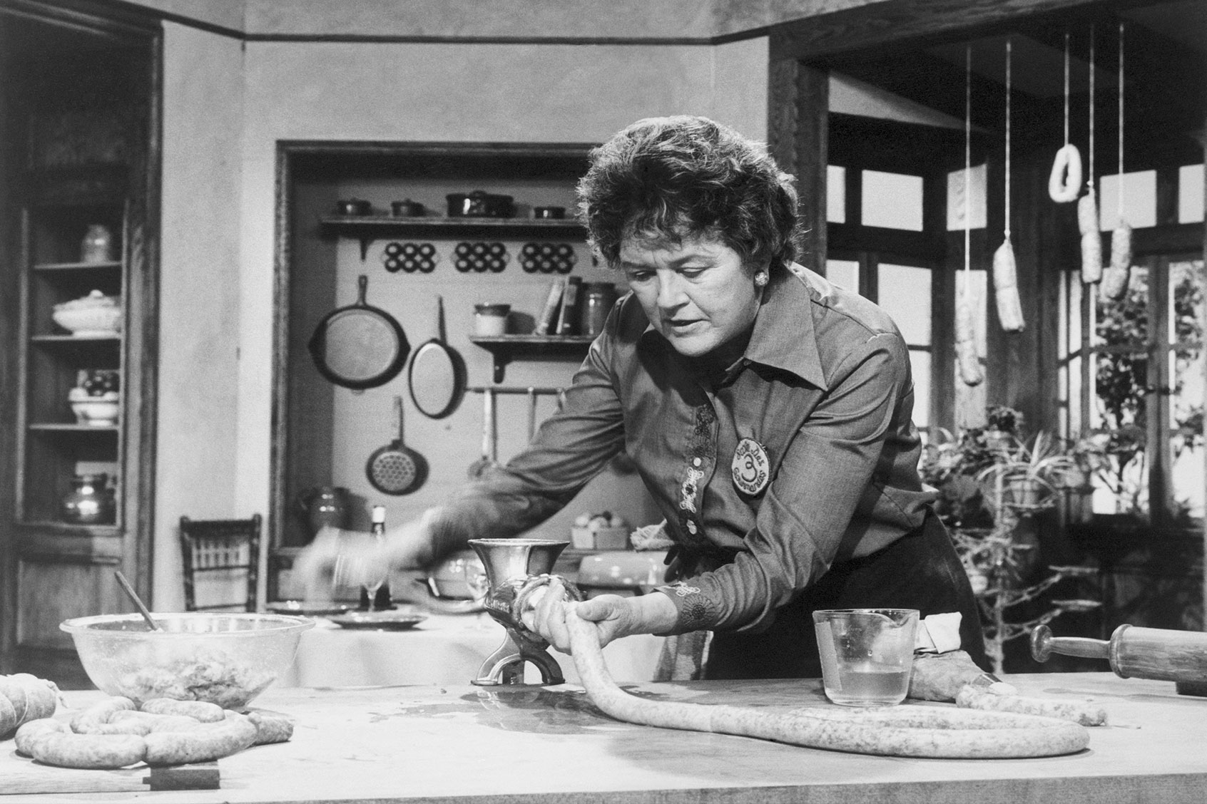 Julia demonstrates the stuffing of sausages. (Getty Images/Bettmann)
