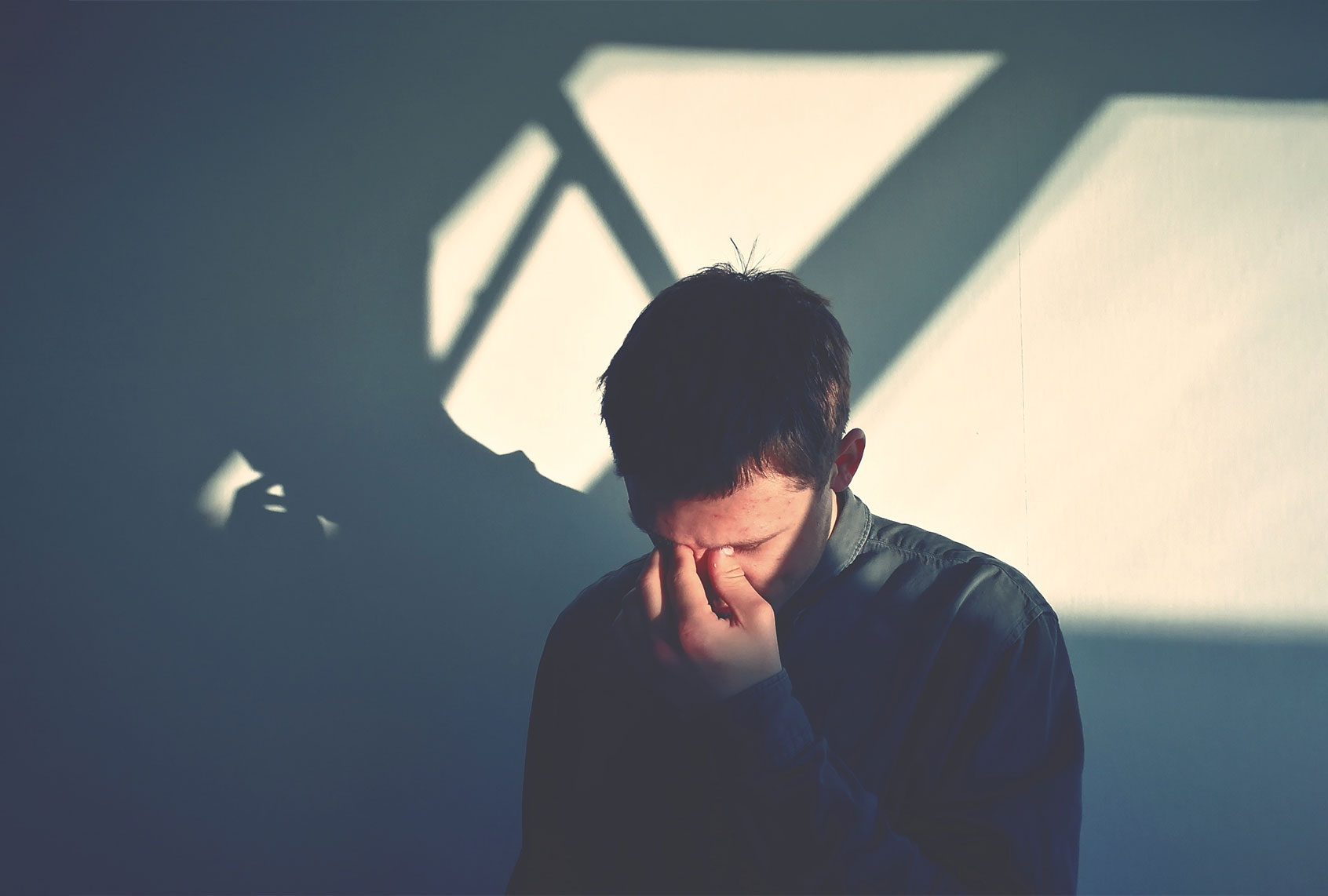 Upset Man Standing Against Wall (Getty images/Simon Josefsson/EyeEm)