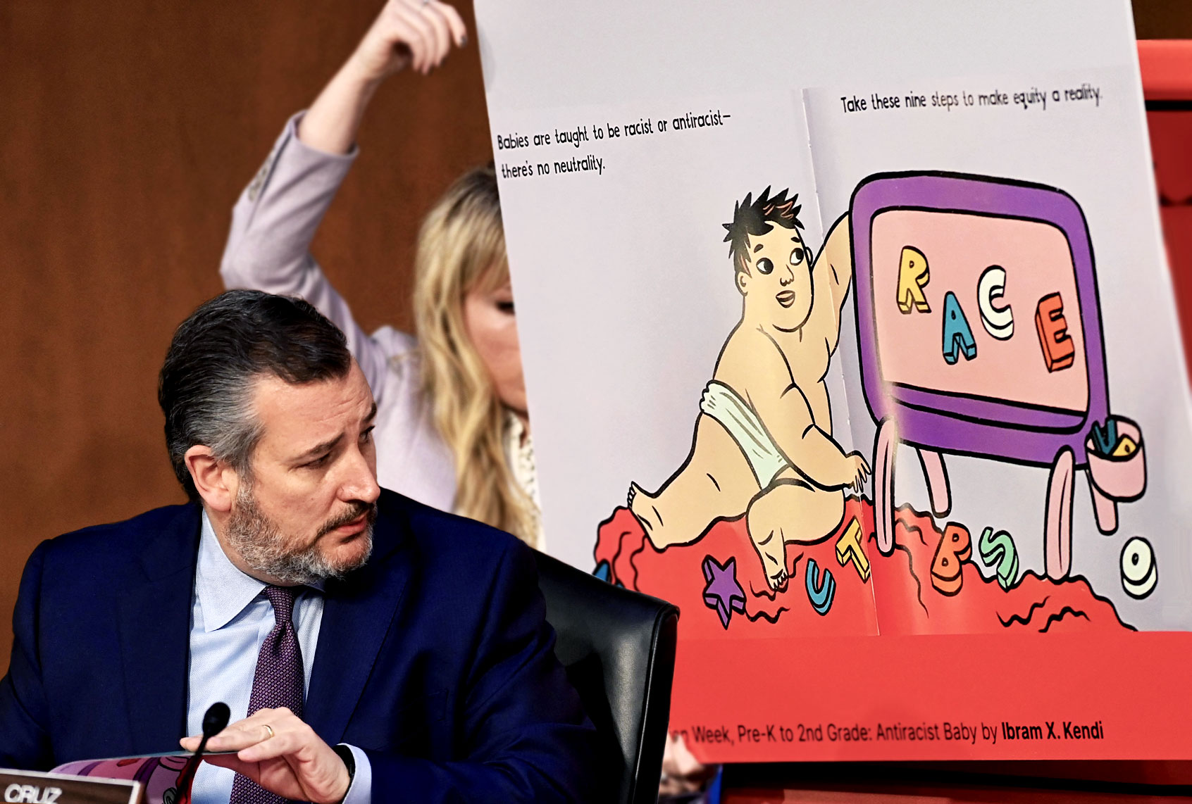 US Senator Ted Cruz (R-TX) looks to a display of a children's book on race while speaking during the confirmation hearing for Judge Ketanji Brown Jackson before the Senate Judiciary Committee on her nomination to be an Associate Justice on the US Supreme Court, in the Hart Senate Office Building on Capitol Hill in Washington, DC, on March 22, 2022. (Photo illustration by Salon/SAUL LOEB/AFP via Getty Images)