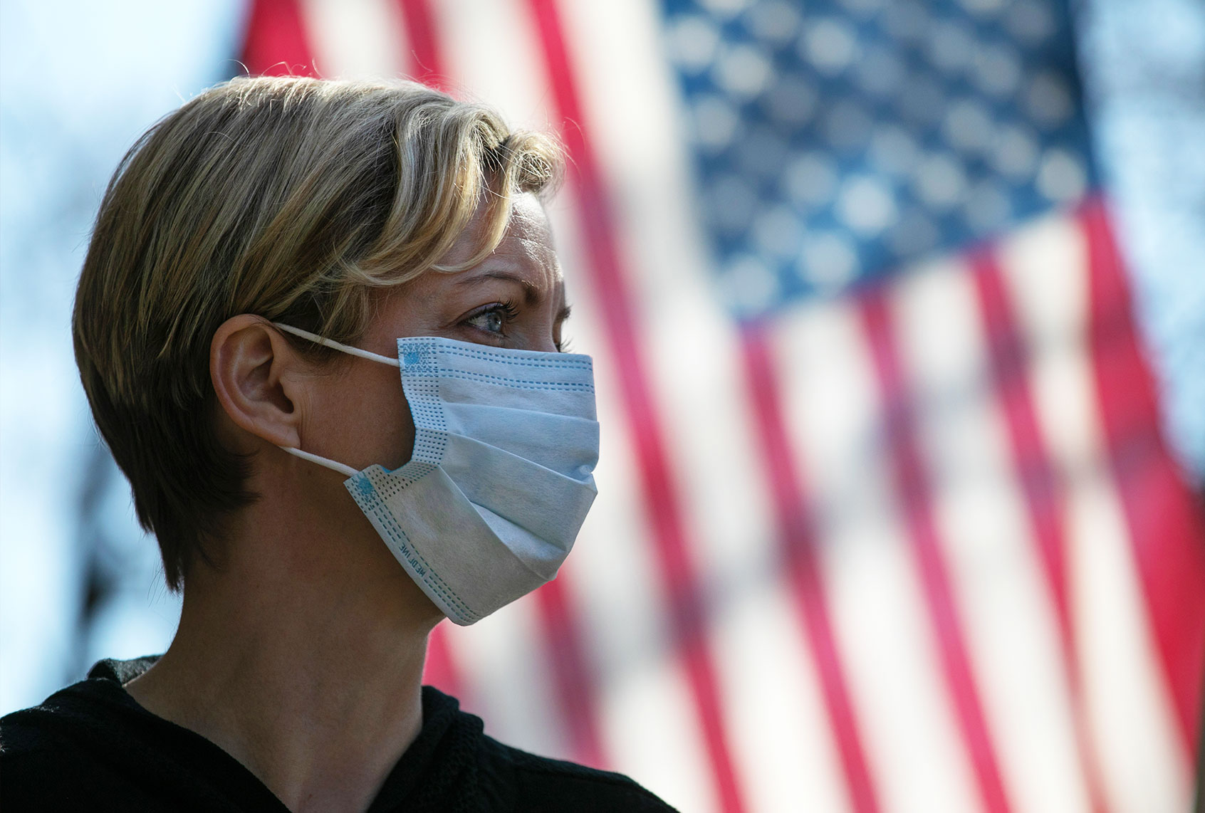 Coronavirus crisis volunteer Rhiannon Navin greets local residents arriving to a food distribution center at the WestCop community center on March 18, 2020 in New Rochelle, New York. New Rochelle has been a hot spot for the COVID-19 pandemic in the U.S. (John Moore/Getty Images)