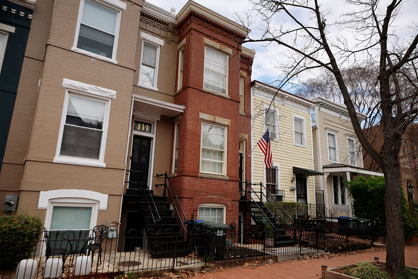 A red-brick row house (C) is seen where DC Metro Police said they found five fetuses inside where anti-abortion activists were living earlier this week in the Capitol Hill neighborhood on April 01, 2022 in Washington, DC. Nine people, some of whom lived or stayed in the house, were indicted Wednesday on federal civil rights counts, with prosecutors alleging that they violated the Freedom of Access to Clinic Entrances Act when they blockaded an abortion clinic with chain and rope in 2020. Authorities do not know how the fetuses were obtained or how they got into the home where anti-abortion activist Lauren Handy was staying before she was arrested. (Chip Somodevilla/Getty Images)