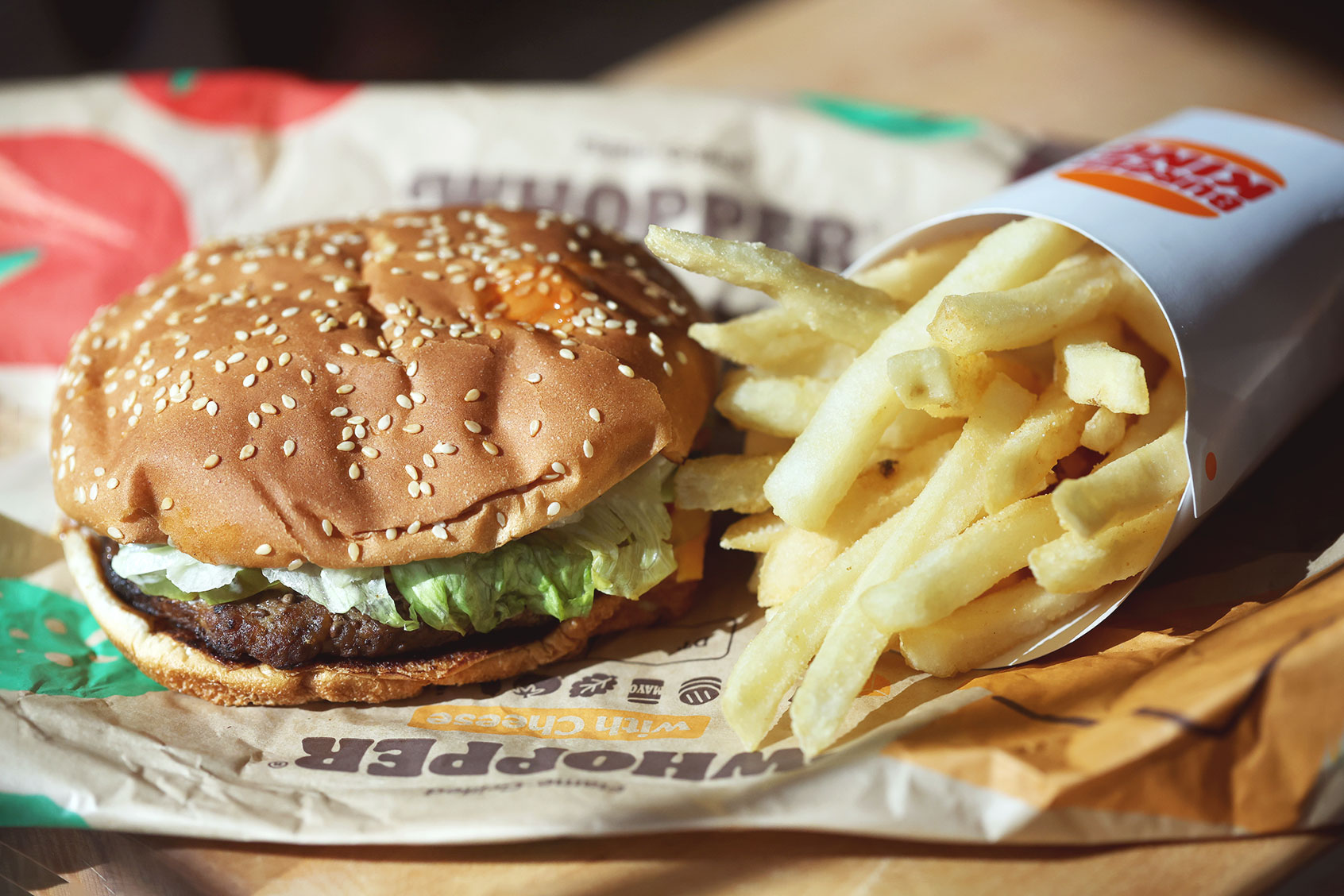 In this photo illustration, a Burger King Whopper hamburger is displayed on April 05, 2022 in San Anselmo, California. A federal lawsuit has been filed and is seeking class-action status alleging that fast-food burger chain Burger King is misleading customers with imagery that portrays its food, including the Whopper burger, as being much larger than what is actually being served to customers. The lawsuit is being brought by South Florida attorney Anthony Russo. (Photo Illustration by Justin Sullivan/Getty Images)