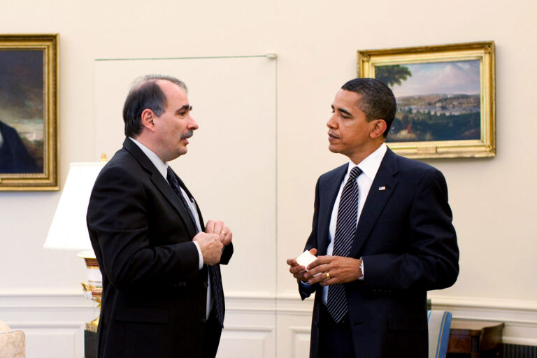 In this handout from the The White House, U.S. President Barack Obama talks with Senior Advisor David Axelrod during a staff meeting in the Oval Office May 12, 2009 in Washington, DC. (Pete Souza/The White House via Getty Images)