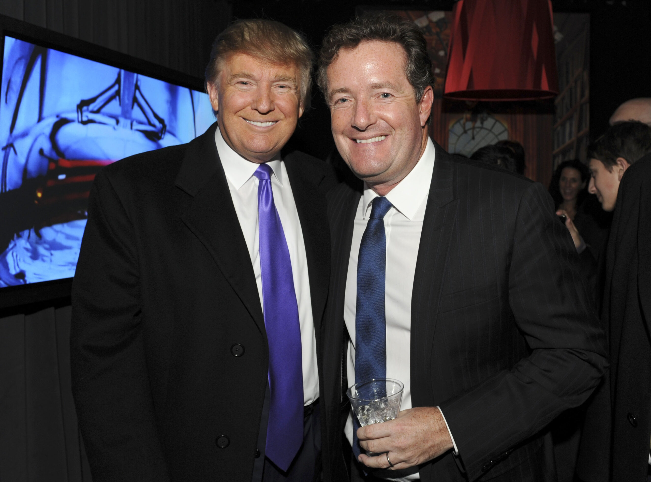 Television Personality Donald Trump and journalist Piers Morgan attend the celebration of Perfumania and Kim Kardashian's appearance on NBC's "The Apprentice" at the Provocateur at The Hotel Gansevoort on November 10, 2010 in New York, New York. (Photo by Mathew Imaging/WireImage)