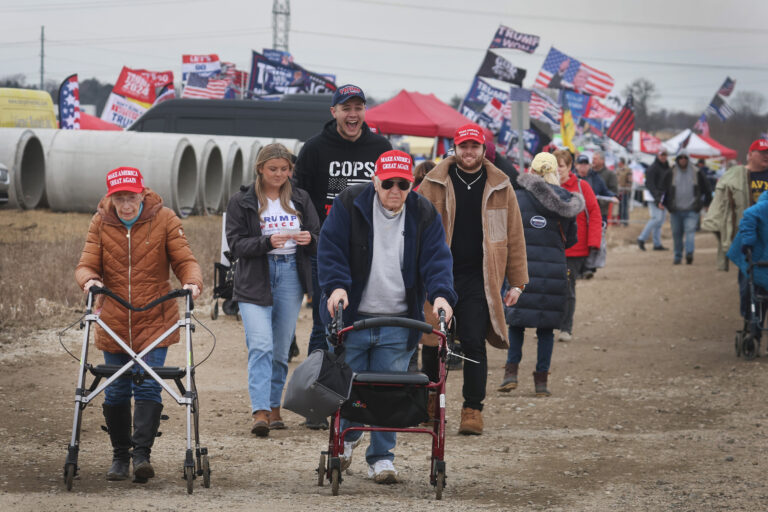 Guests arrive for a rally hosted by former President Donald Trump on April 02, 2022 near Washington, Michigan. (Photo by Scott Olson/Getty Images)
