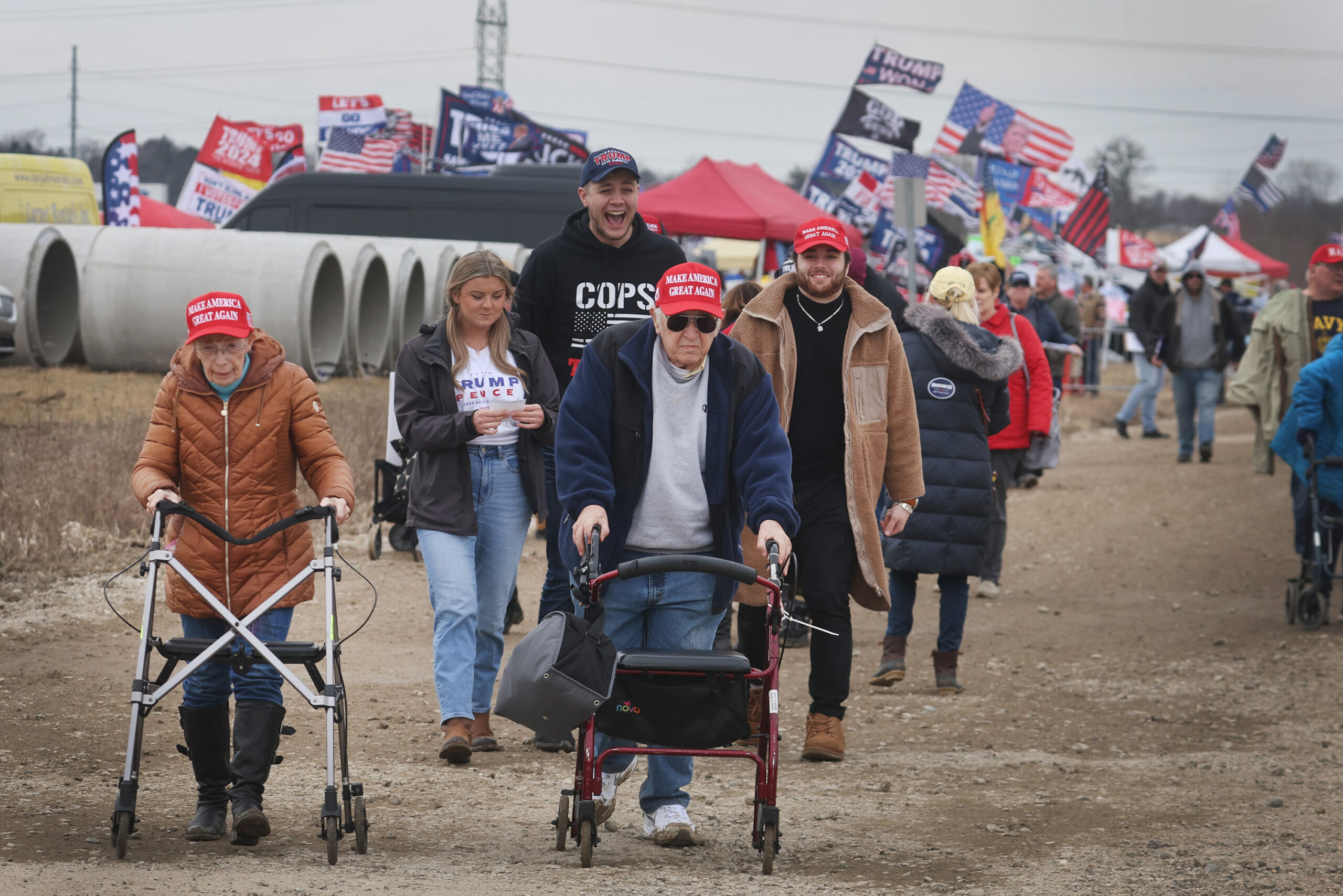 Guests arrive for a rally hosted by former President Donald Trump on April 02, 2022 near Washington, Michigan. (Photo by Scott Olson/Getty Images)