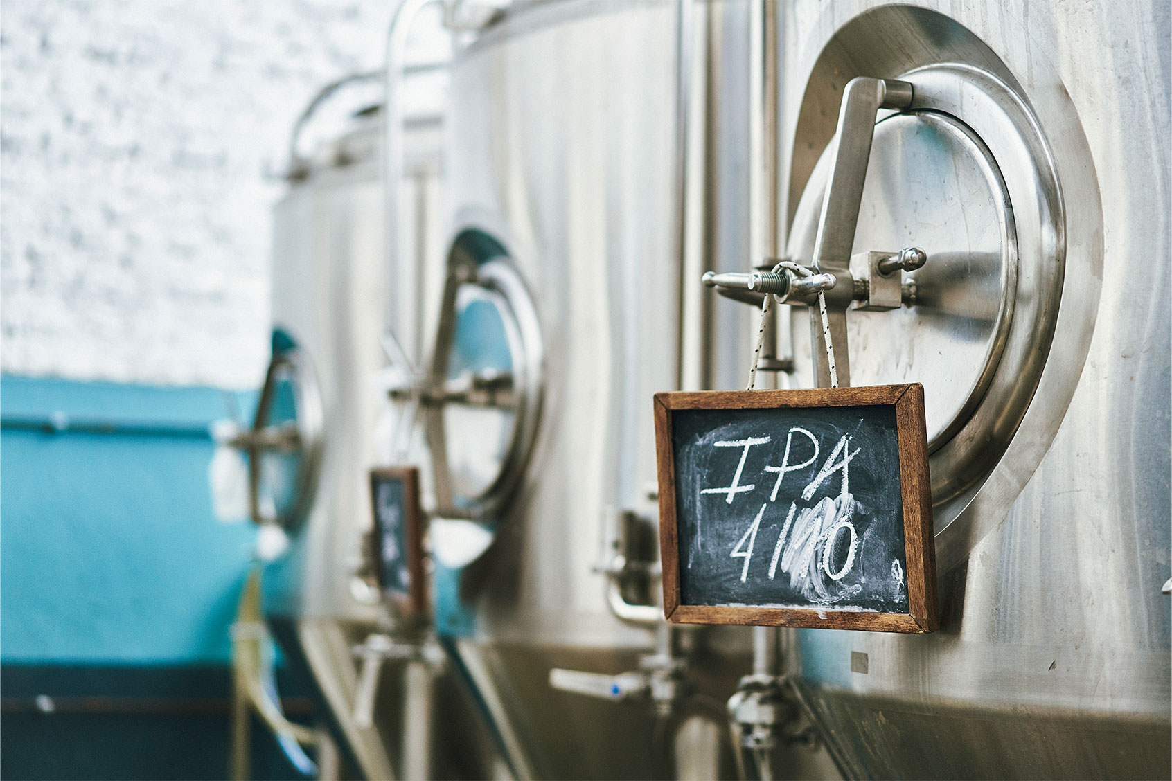 Close-up of vat at Buenos Aires craft beer brewery with blackboard label indicating IPA or India Pale Ale, a hoppy beer style (Getty Images/xavierarnau)