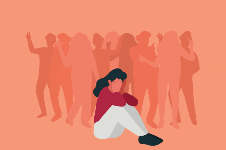 Sad woman sitting in the crowd (Getty Images/studiostockart)
