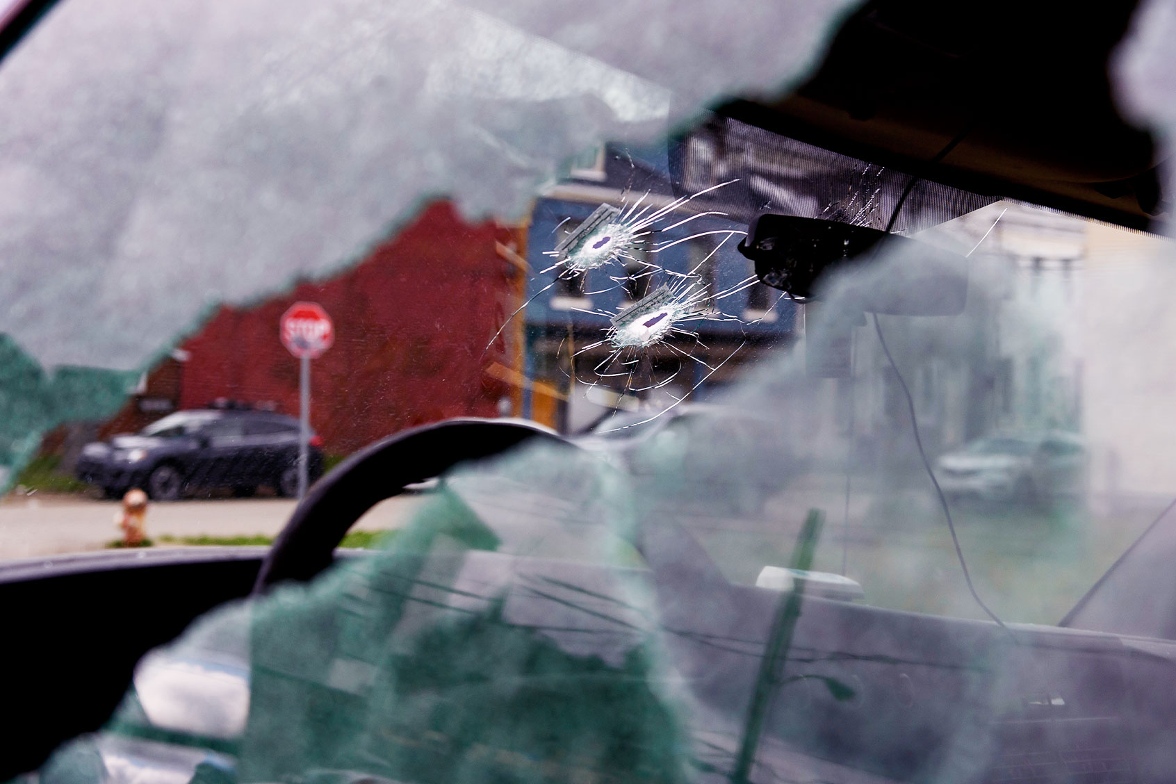 Bullet holes are seen in a van parked outside an Airbnb apartment rental along Suismon Street on April 17, 2022 in Pittsburgh, Pennsylvania. Last night, a shooting at a house party at the rental left two people dead and nine injured. (Jeff Swensen/Getty Images)