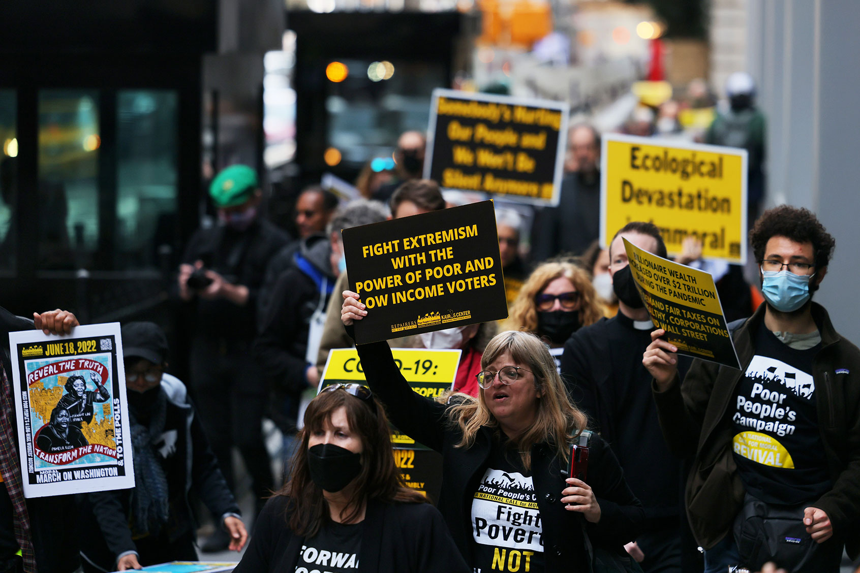 People participate in a march to Trinity Church for a moral Mass on April 11, 2022 in New York City. The event, dubbed the Mass Poor People's & Low-Wage Workers' Assembly and Moral March on Washington, DC and led by the Revs. Dr. William J. Barber and Dr. Liz Theoharis, is part of a Polls Mobilization tour. (Michael M. Santiago/Getty Images)