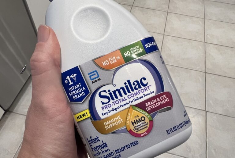 Person's hand holding a bottle of Similac baby formula from Abbott Laboratories in Lafayette, California, May 13, 2022. (Photo by Smith Collection/Gado/Getty Images)