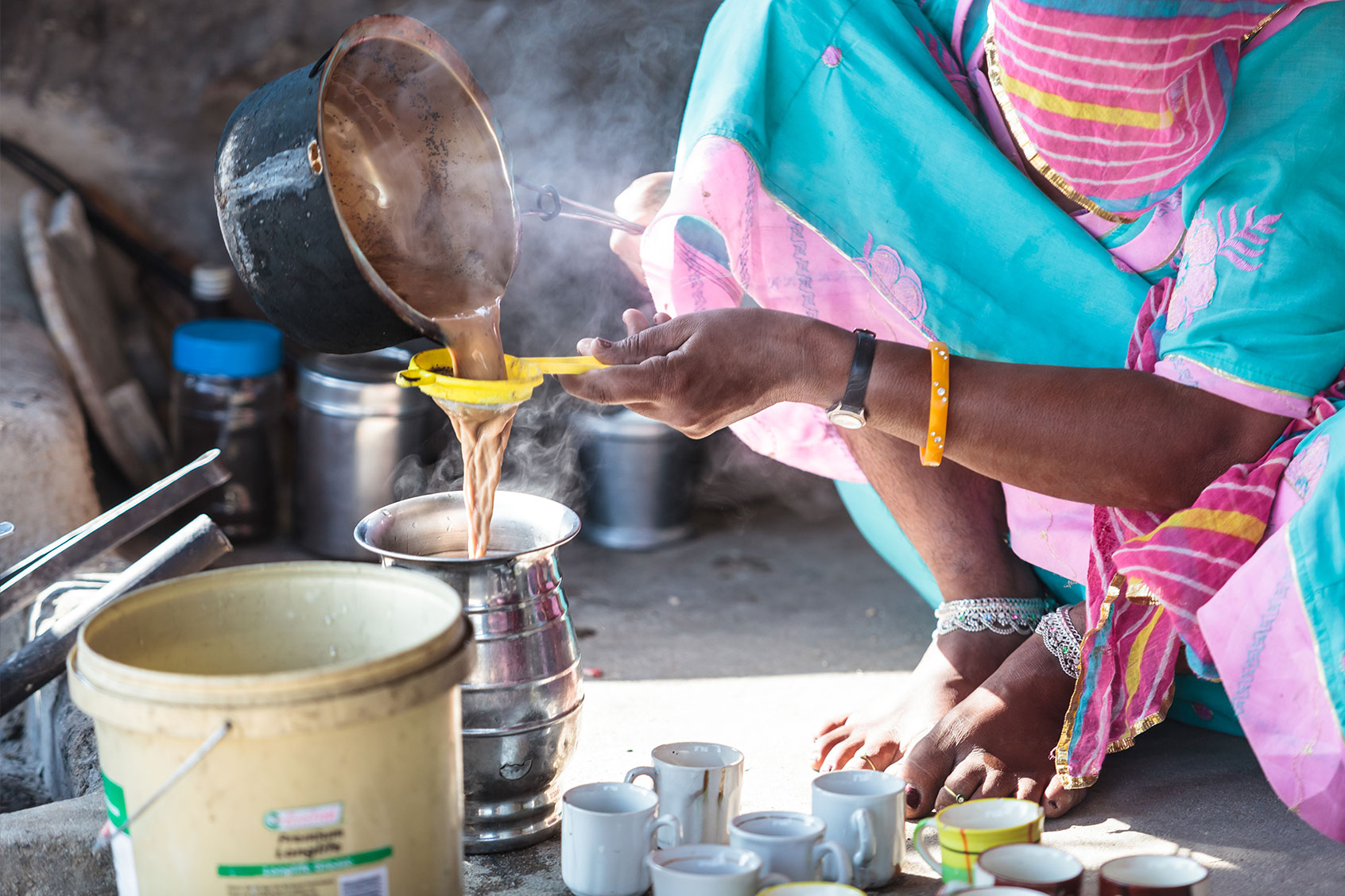 Bishnoi woman preparing Bhang tea from leaves and flowers (buds) of the female cannabis in rural Rajasthan, India (Getty Images/Pavel Gospodinov)