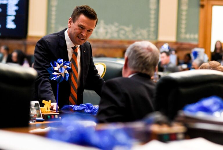Former assistant minority leader Cole Wist speaks to Rep. Larry Liston at the Colorado State Capitol on April 25, 2018. (Aaron Ontiveroz/The Denver Post via Getty Images)