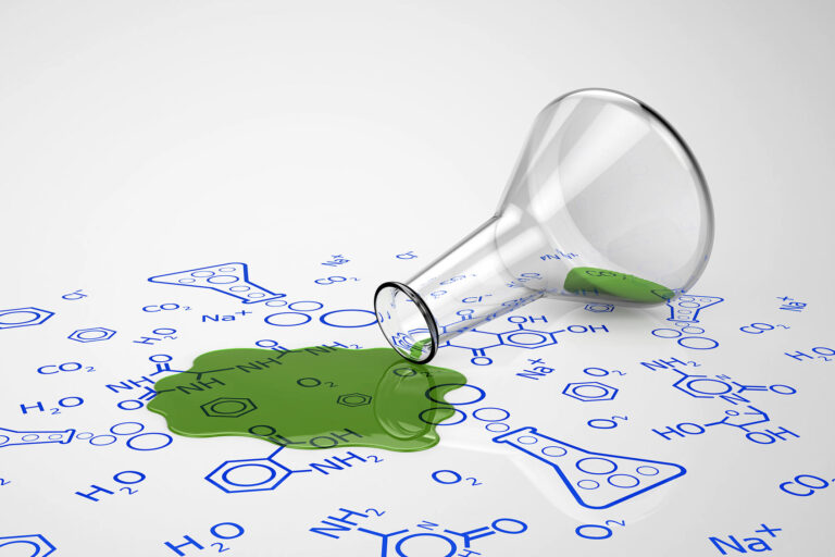 Green liquid spilled from test tube (Getty Images/mrdoggs)