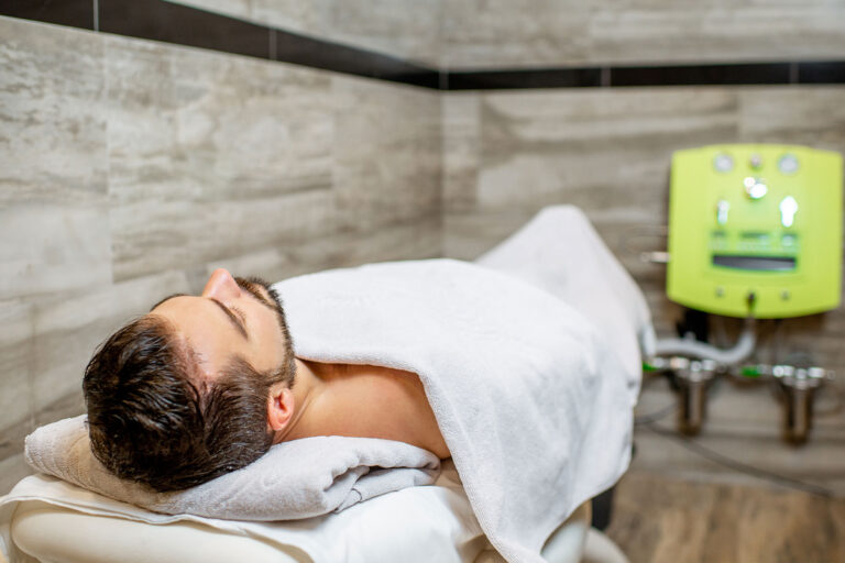 Man lying on the couch ready for the hydrocolonotherapy in the SPA and medical salon (Getty Images/Ross Helen)