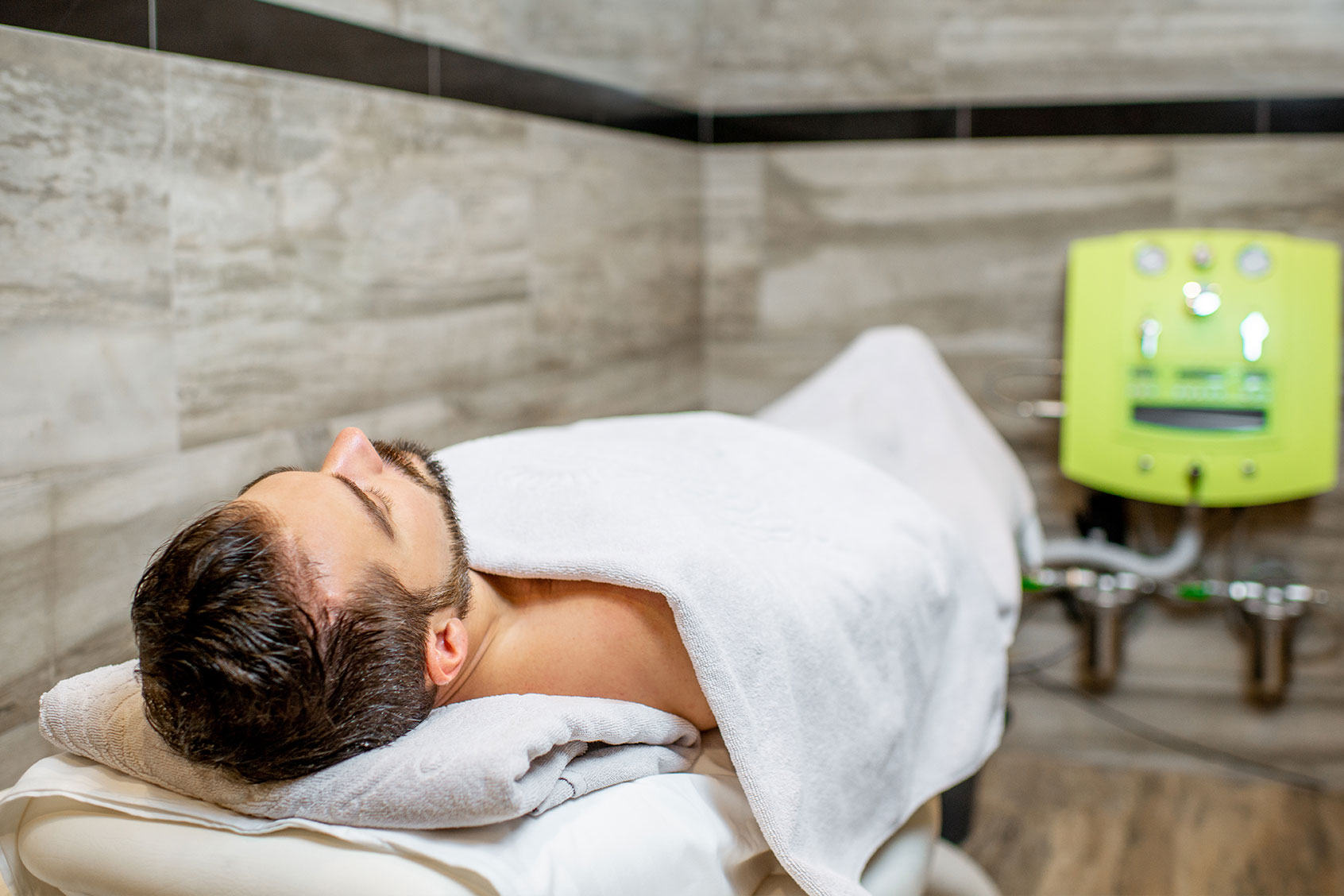 Man lying on the couch ready for the hydrocolonotherapy in the SPA and medical salon (Getty Images/Ross Helen)