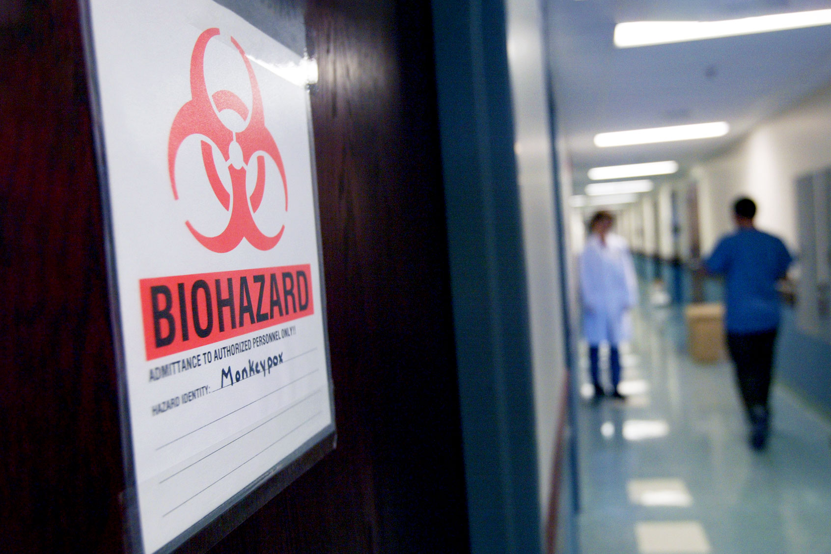 At the University of Minnesota's Veterinary Diagnostic Laboratory, the door to the lab where the first step is taken in the testing of samples for the monkeypox virus has a warning sign to let others know not to enter. (JUDY GRIESEDIECK/Star Tribune via Getty Images)
