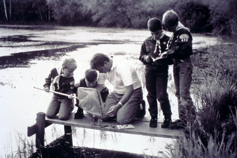 Boy Scouts Examining Specimens on Dock (Getty Images/Ed Bock)