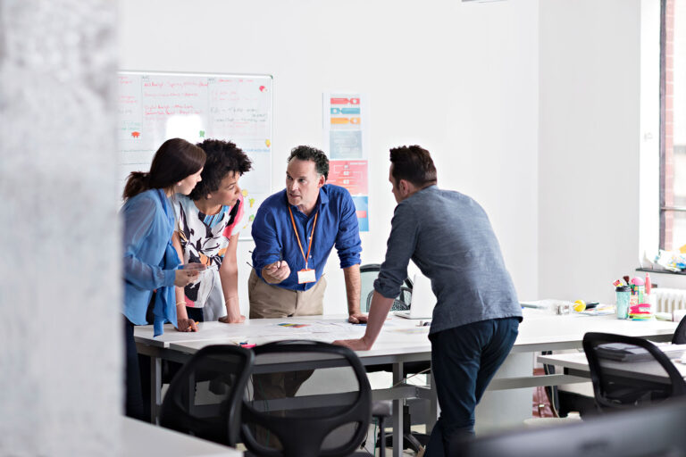 Business people have a meeting in a tech start-up office (Getty Images/Compassionate Eye Foundation/Gary Burchell)