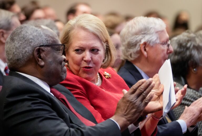 Supreme Court Justice Clarence Thomas sits with his wife and conservative activist Virginia Thomas while he waits to speak at the Heritage Foundation on October 21, 2021 in Washington, DC. (Drew Angerer/Getty Images)