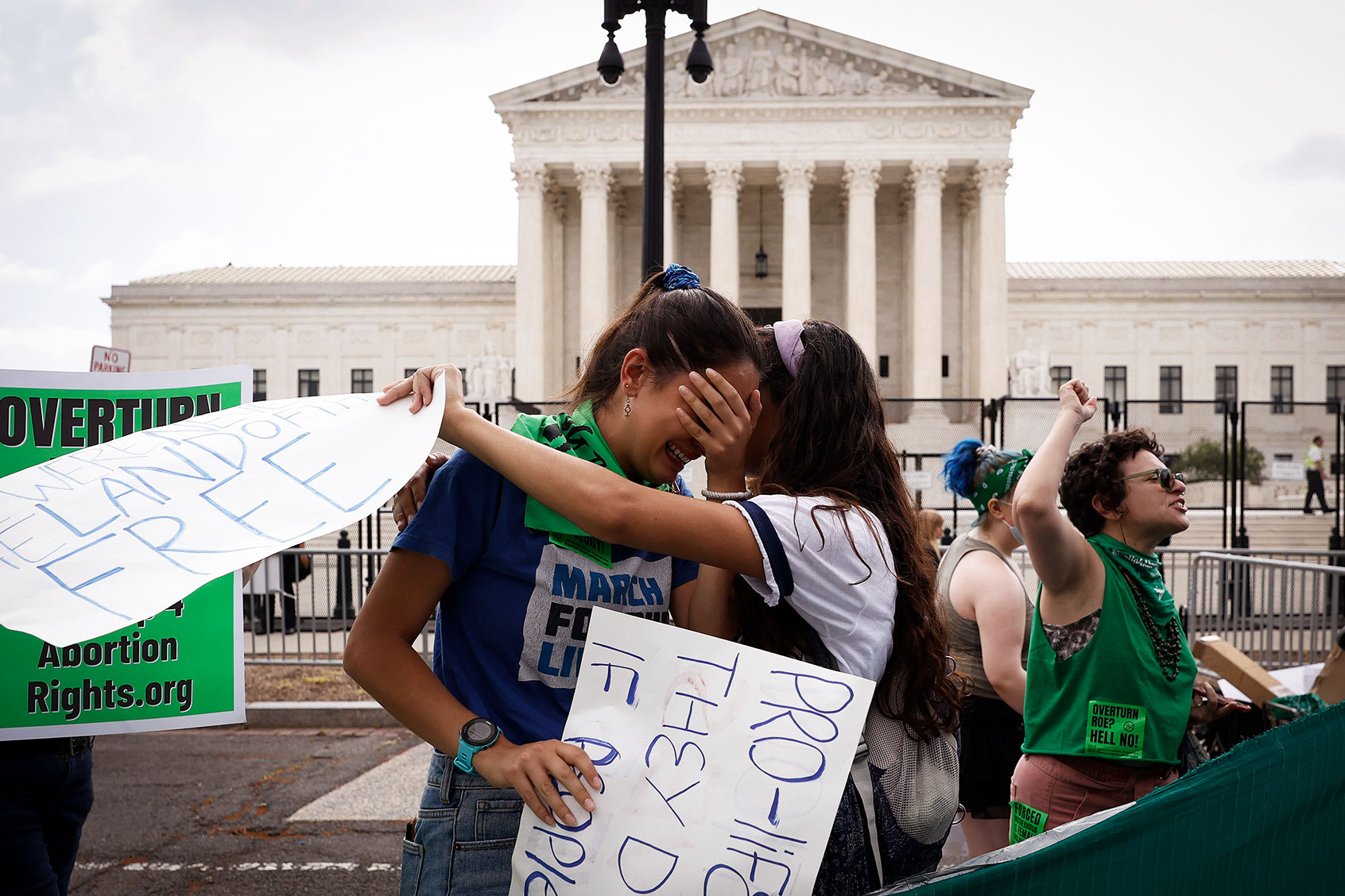 Abortion rights activists Carrie McDonald (L) and Soraya Bata react to the Dobbs v Jackson Women’s Health Organization ruling which overturns the landmark abortion Roe v. Wade case in front of the U.S. Supreme Court on June 24, 2022 in Washington, DC. (Anna Moneymaker/Getty Images)