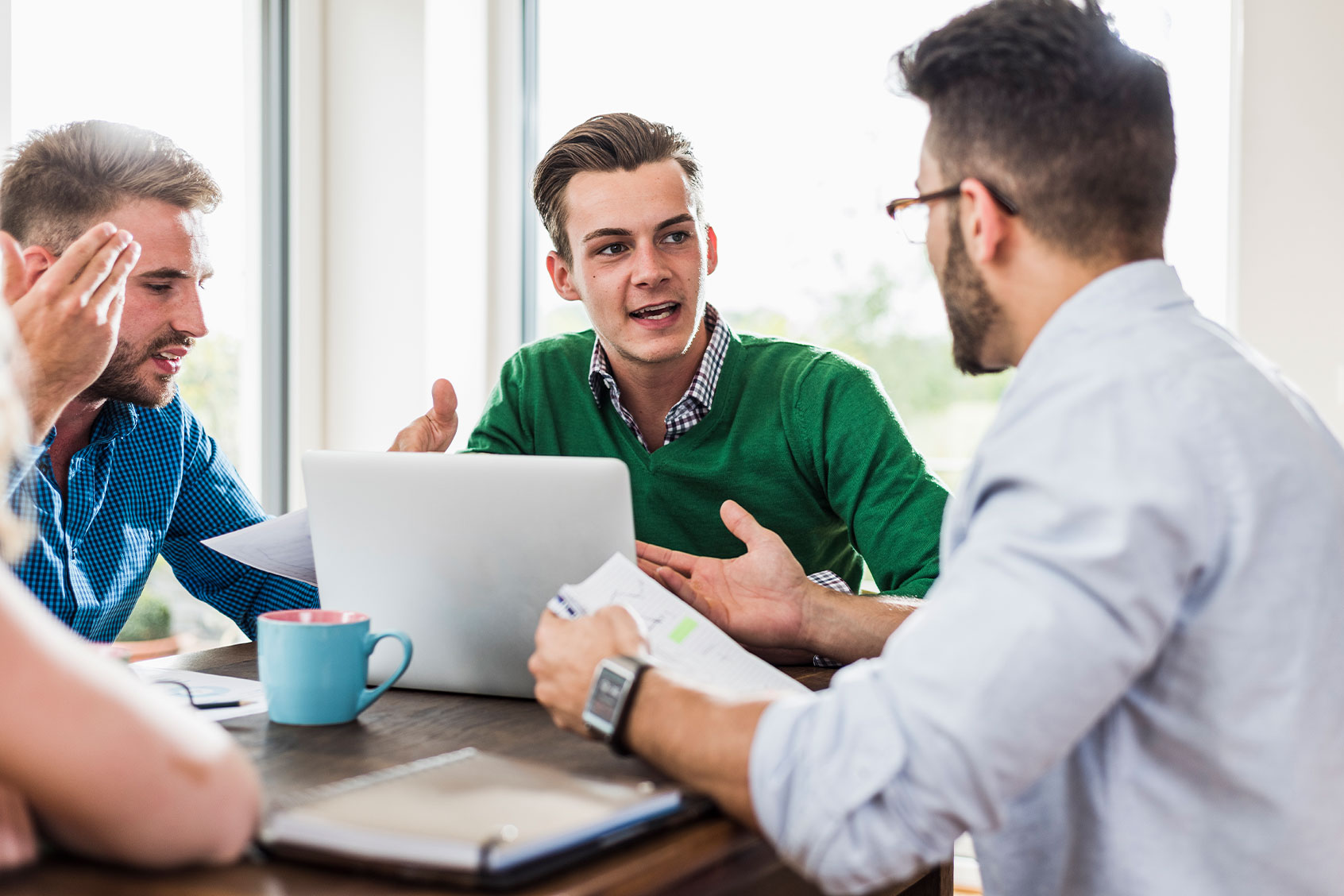 Young professionals arguing in office (Getty Images/Westend61)
