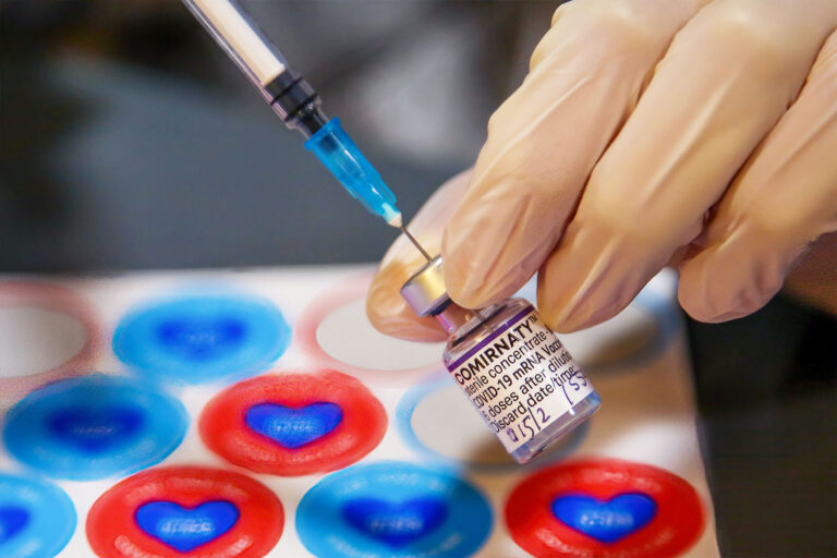 An NHS staff prepares to administer the Covid-19 vaccination booster jab during a press tour at a vaccination center (Dinendra Haria/SOPA Images/LightRocket via Getty Images)