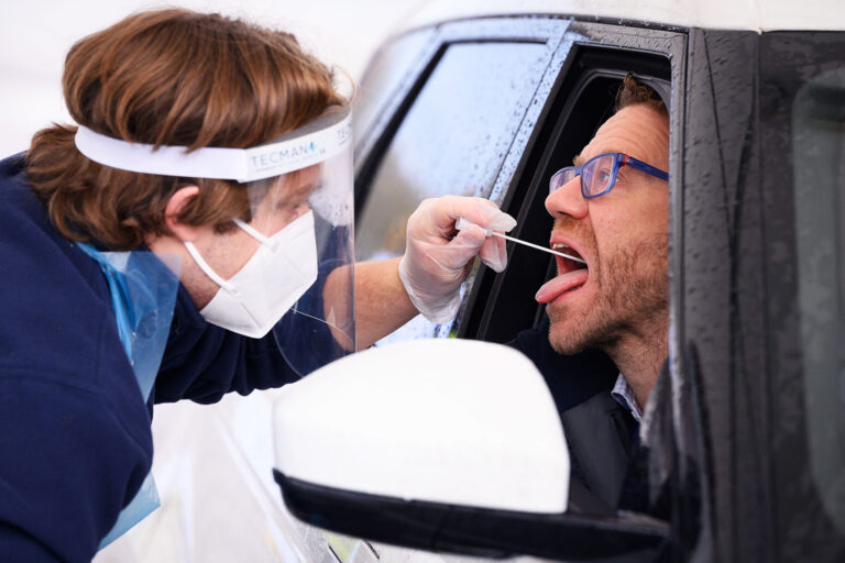 Man takes a PCR swab test at Gatwick Airport on November 27, 2020 in London, England. (Leon Neal/Getty Images)