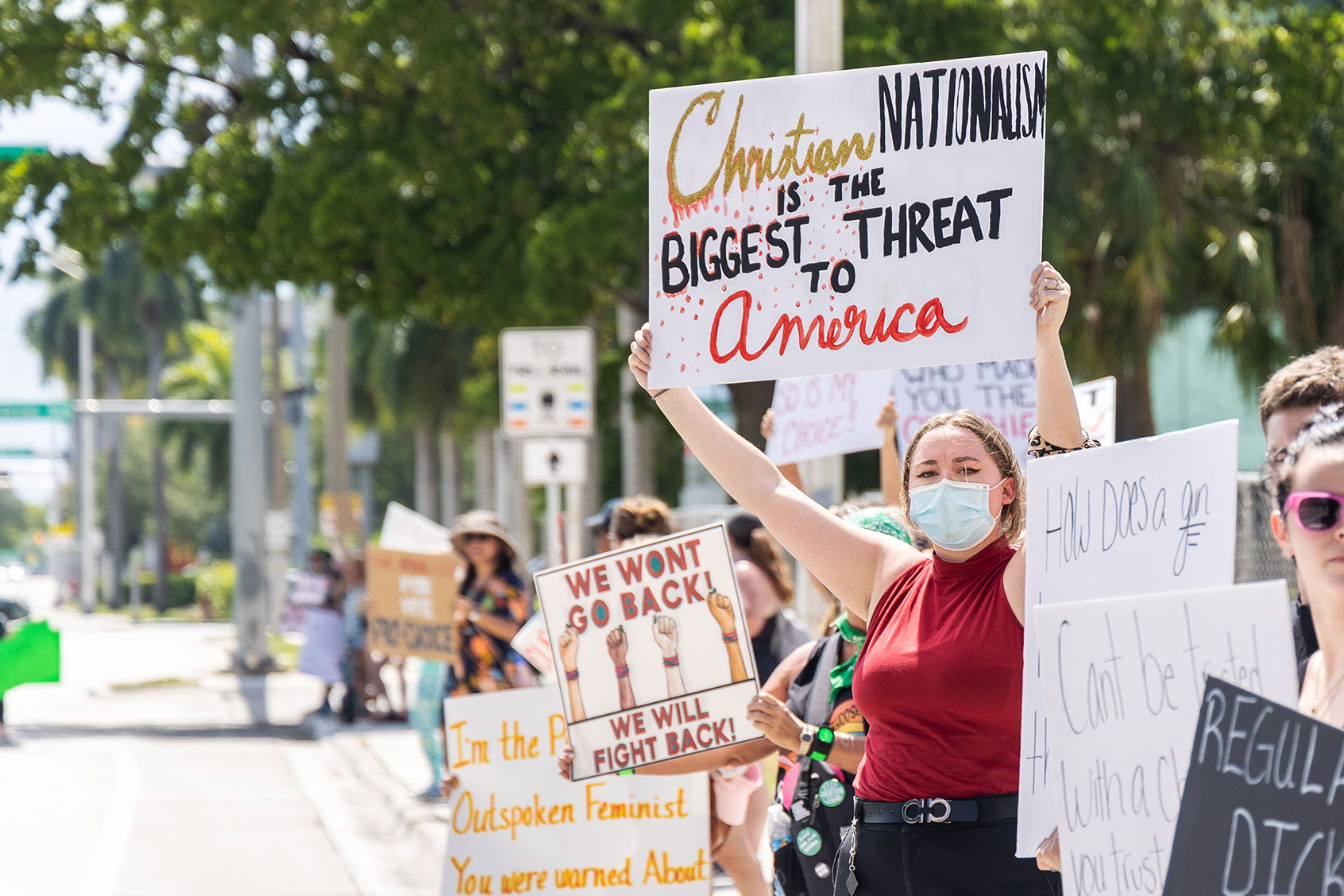 An abortion rights activist holds a sign at a protest in support of abortion access, March To Roe The Vote And Send A Message To Florida Politicians That Abortion Access Must Be Protected And Defended, on July 13, 2022 in Fort Lauderdale, Florida. (John Parra/Getty Images for MoveOn)